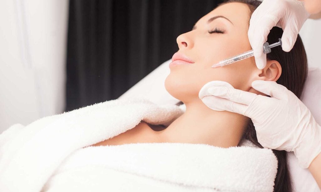 woman getting cheek dermal fillers in chillicothe, ohio